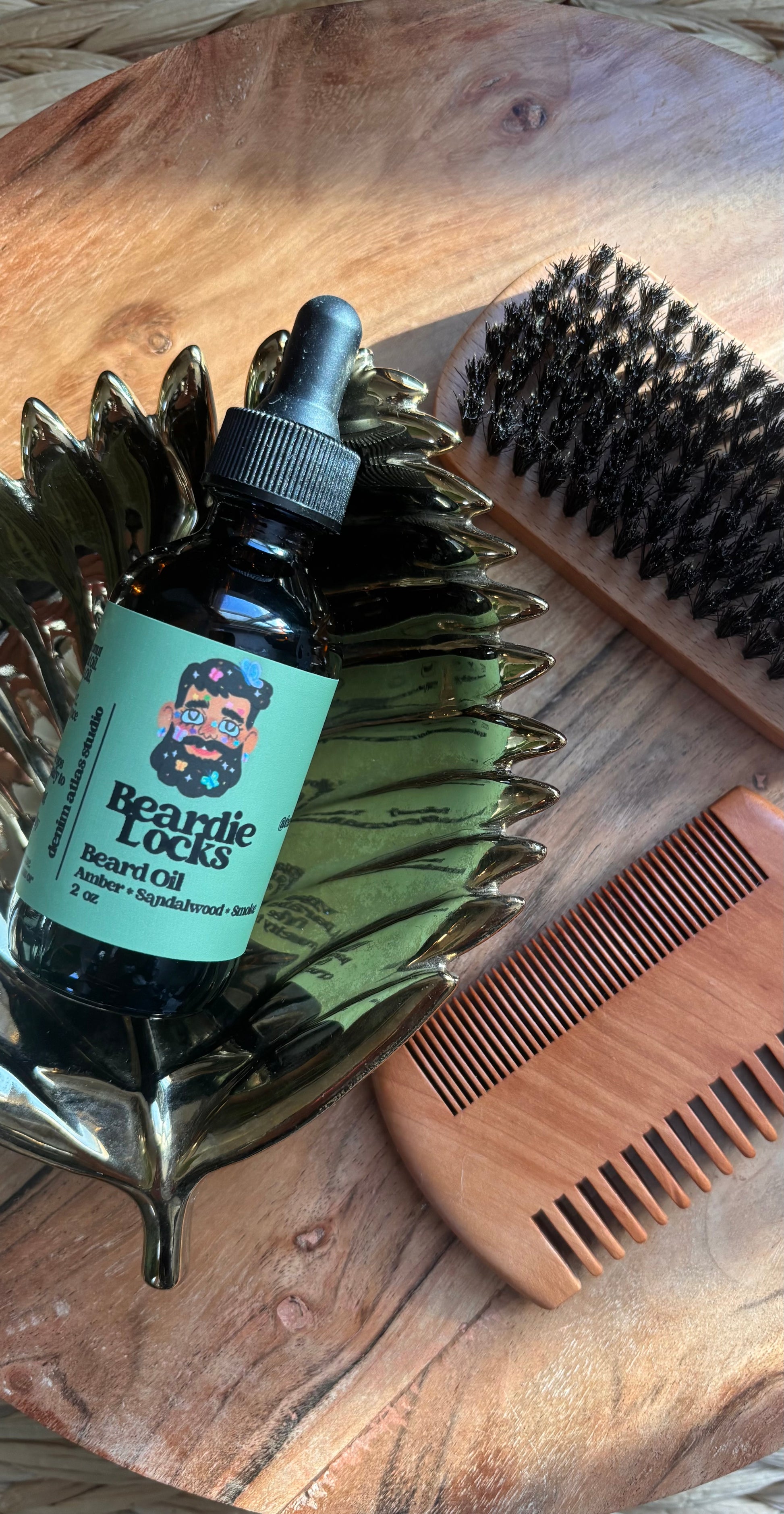 Beard care product with brush and comb on a wooden surface